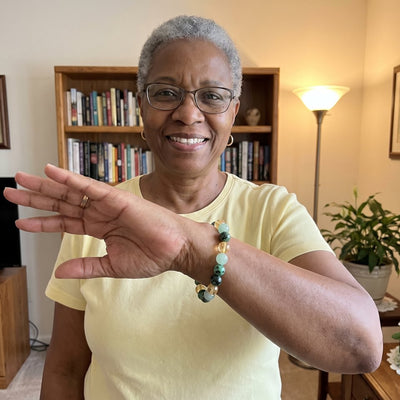 A customer wearing The Wealth Shift bracelet