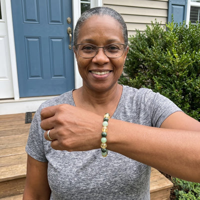A customer wearing The Wealth Shift bracelet