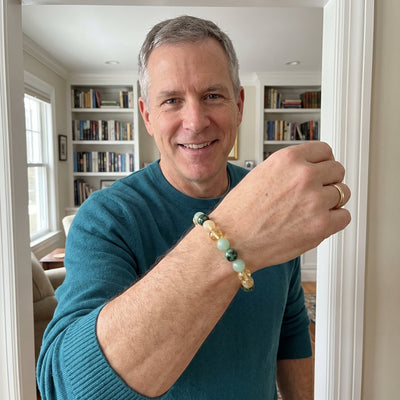 A customer wearing The Wealth Shift bracelet