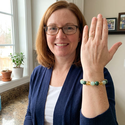 A customer wearing The Wealth Shift bracelet