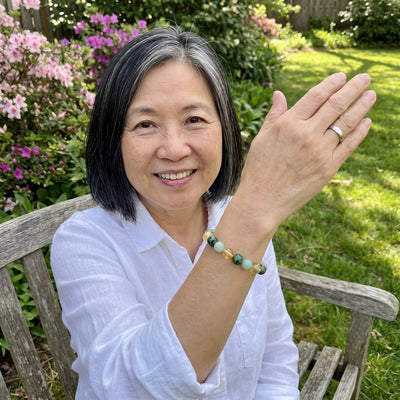 A customer wearing The Wealth Shift bracelet