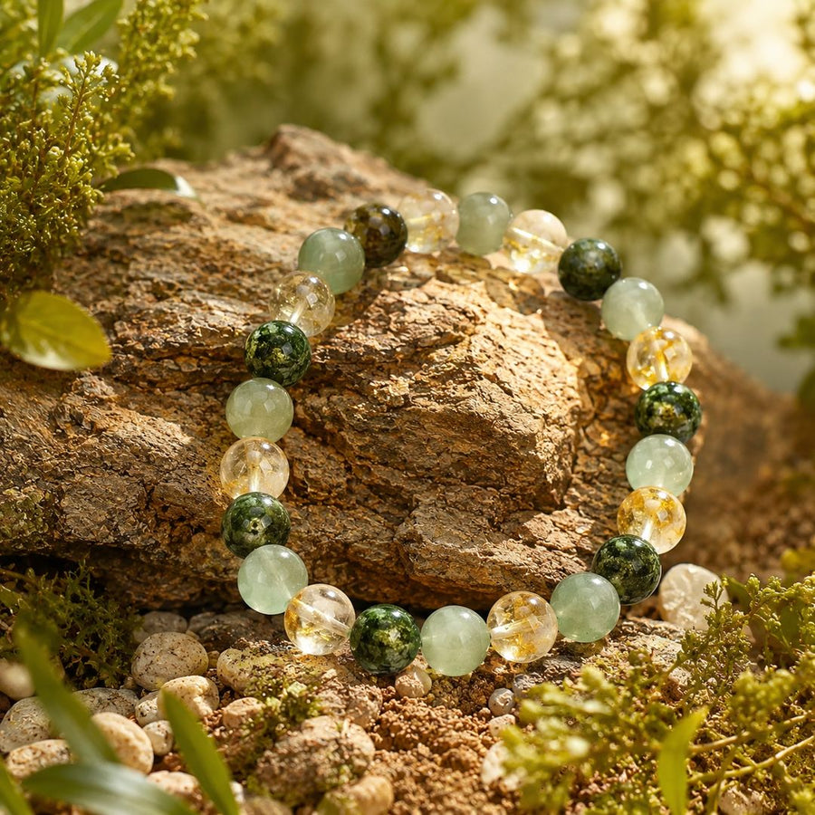 The Wealth Shift bracelet resting on a rock in the evening light
